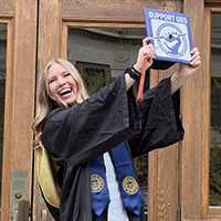 Skyler Kriese '20 in her master's graduation cap and gown.
