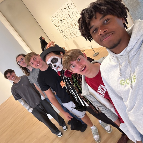 Nico Candelario Alves Pinto, Cash Carrillo, Griffin Mello, Timothy Scherer, and Cole Alexis enjoyed the company of a San Jose Museum of Art staff member with traditional face painting for the Dia de los Muertos Celebration.