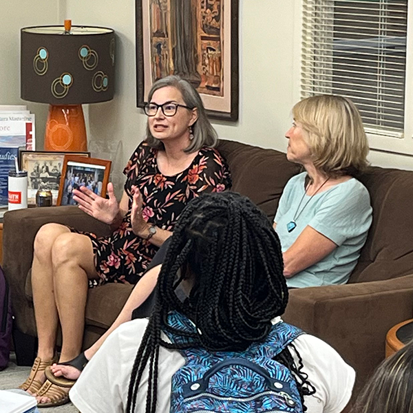 Dr. Emily Reimer-Barry speaks as Karen Peterson-Iyer looks on.