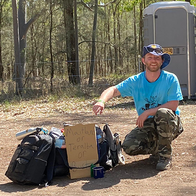 Brendan Webb outdoors with his gear