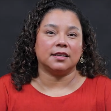 Andrea Pappas (Art & Art History) looks through a magnifying glass